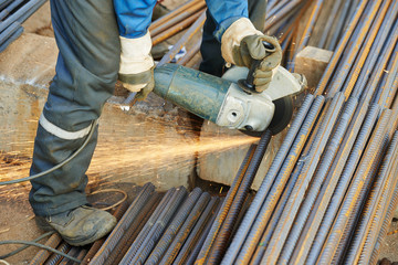 worker cutting rebar by grinding machine