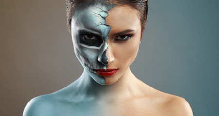 beautiful woman with makeup skeleton half