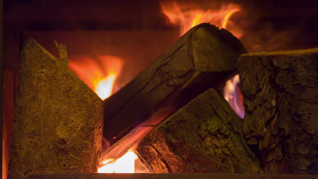 Fireplace. Burning wood in stone