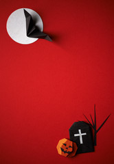 Halloween symbols origami  on a red background