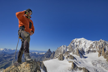 Young mountaineer talking on the phone, copy space