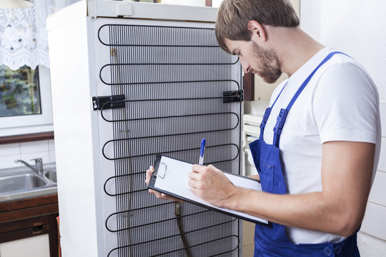 Handyman During Fridge Repair