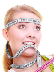 Obsessed girl with gray measure tapes around her head