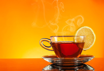 Tea in cup with orange background