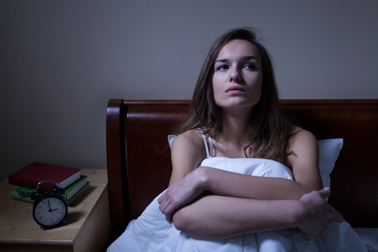 Pensive woman stying sleepless at night