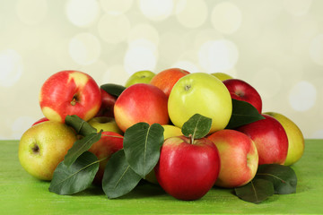 Ripe apples on table on bright background