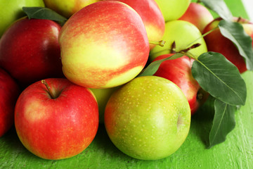 Ripe apples on wooden background