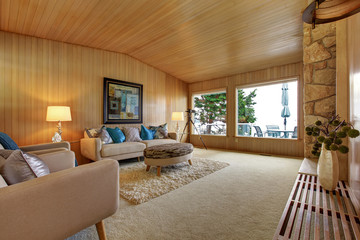 Beautiful house interior with wooden plank trim. Cozy living roo