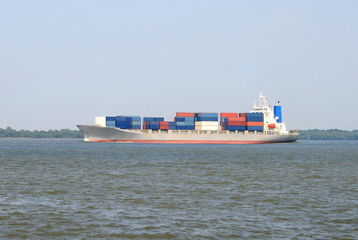 Large container ship arriving on the sea