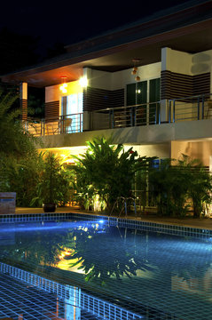 Resort with swimming pool at night