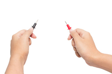 Electrician holding probes from voltmeter