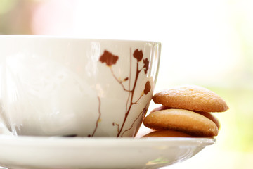 Cup of coffee with crackers.