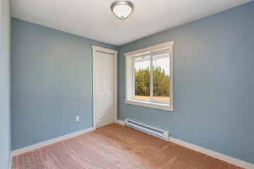 Small light blue bedroom in empty house