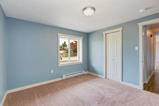 Light Blue Bedroom With Closets