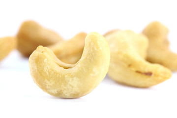 Several cashew nuts, isolated on white
