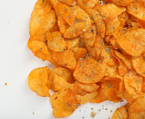 Homemade potato chips isolated on white
