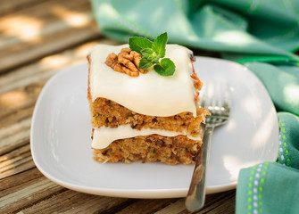 A Piece of Zucchini and Walnut Cake with Cream Cheese Frosting