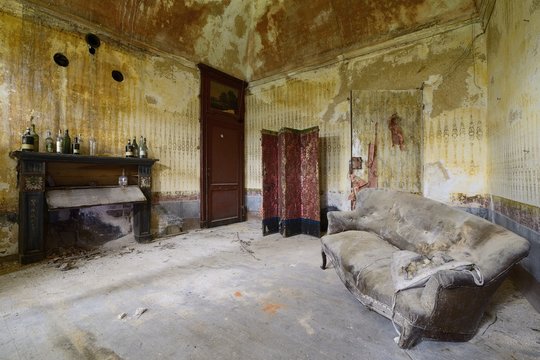 old abandoned living room with sofa