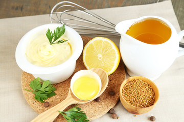Mayonnaise ingredients on wooden background
