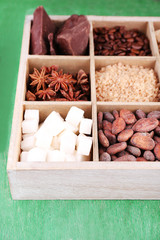 Wooden box with set of coffee and cocoa beans, sugar cubes,