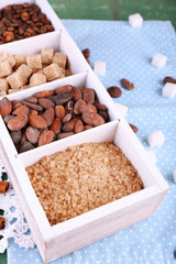 Wooden box with set of coffee and cocoa beans, sugar cubes