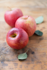 Red apple fruit, on wooden table