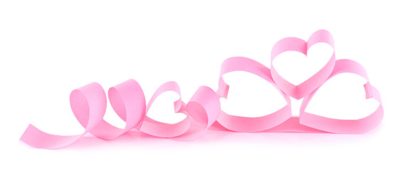 Heart shaped pink paper ribbon isolated on white
