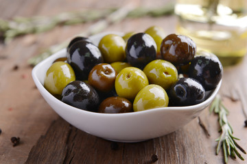 Different marinated olives on table close-up