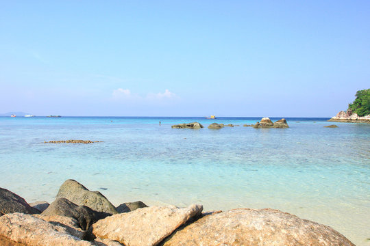 Fototapeta Rocks , sea and blue sky - Lipe island Thailand