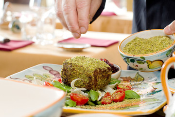 serving dish with tuna fillet cooked in sesame crust and fresh v