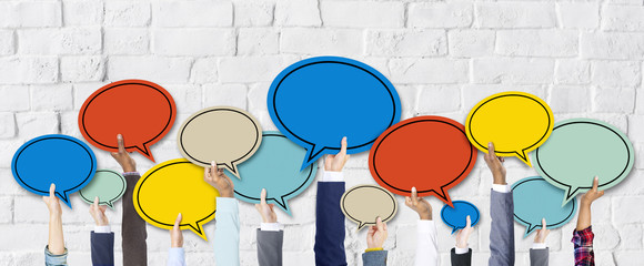 Group of Hands Holding Speech Bubbles