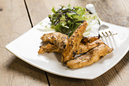 Grilled chicken strips with side salad