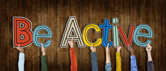 Group of Hands Holding Word Be Active