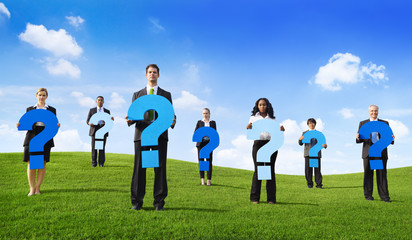 Group of Business People Holding Question Mark