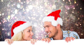 Composite image of young festive couple