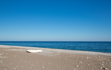 Fototapeta na wymiar Lonely boat on a beach