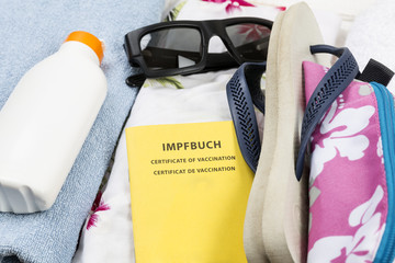 Reisegepäck mit Impfbuch