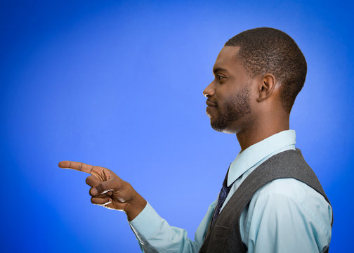 side profile portrait man pointing index finger at copy space