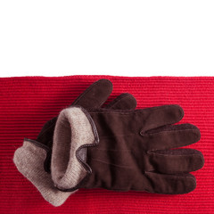 Brown gloves on red scarf