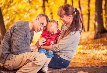 Fototapeta premium happy family at fall forest