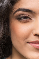 Fototapeta premium Closeup of half face of young fresh woman.