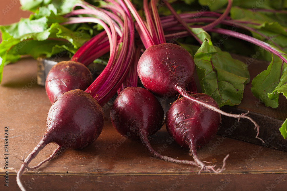 Wall mural fresh beetroot on wooden background