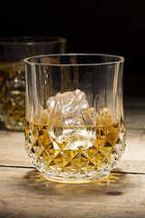 Alcoholic drink in glass with ice