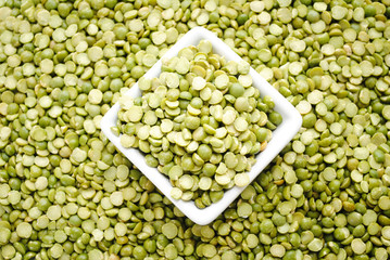 Background of Split Peas in a White Quare Bowl