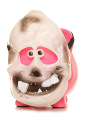 Piggy bank wearing a skeleton halloween mask