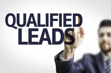 Business man pointing the text: Qualified Leads