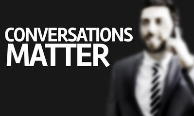 Business man with the text Conversations Matter