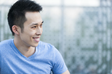 Young asian man smiling