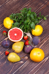 Grapefruits, pears, lemons, figs, strawberry, pomelo; still life