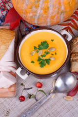 Fresh cooked pumpkin soup with smoked chicken breast